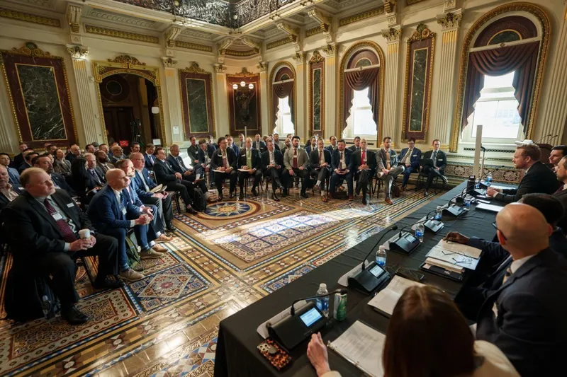 Federal cybersecurity leaders and technology companies seated around the Indian Treaty Room during the convening